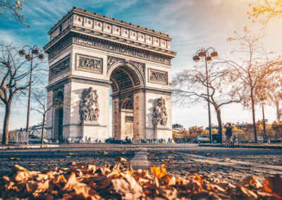 Arc de Triomphe located in Paris, in autumn scenery.